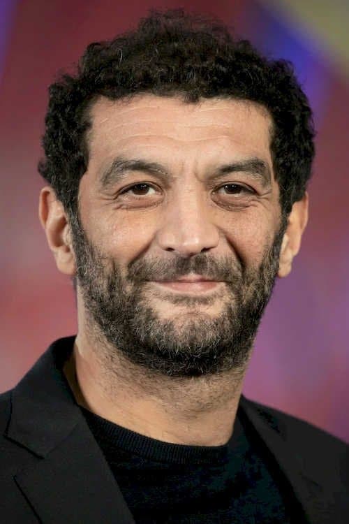 Ramzy Bedia as Charas in Lost Bullet
