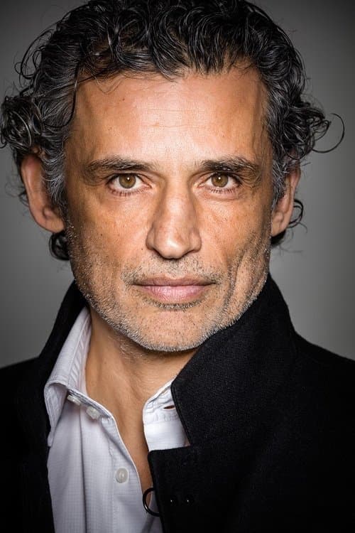 Enrico Lo Verso as Max in Room in Rome