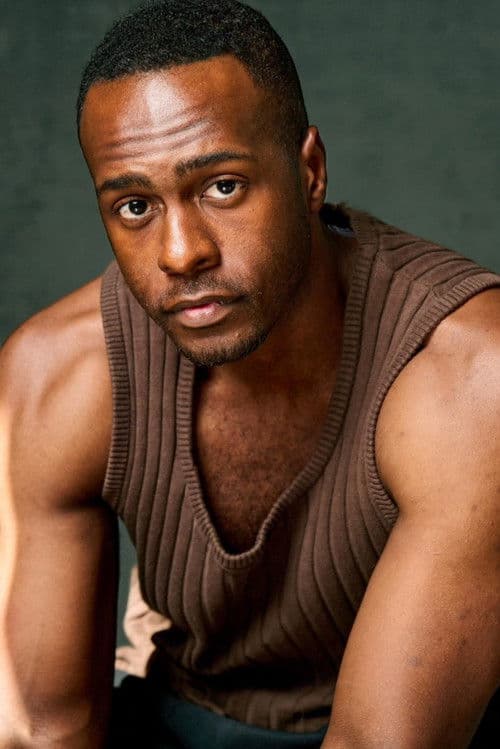 Andrew C. English Jr. as Tron in Oscar Shaw